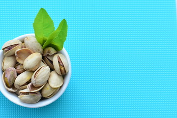 Pistachios in colorful and natural backgrounds