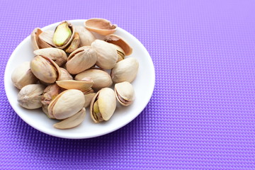 Pistachios in colorful and natural backgrounds