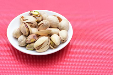 Pistachios in colorful and natural backgrounds