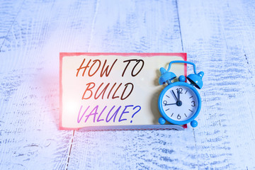 Writing note showing How To Build Value question. Business concept for Ways for developing growing...