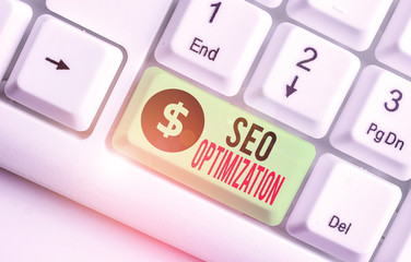 Writing note showing Seo Optimization. Business concept for increasing visibility of a website or a...