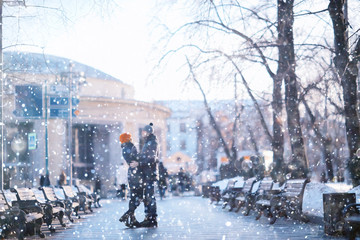couple snowing city street