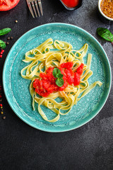 pasta tagliatelle tomato sauce (delicious main course) menu concept. background. top view. copy space
