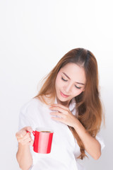 Asian woman portrait with perfect skin and wearing a white shirt in happiness holding red coffee cup isolated on white background.