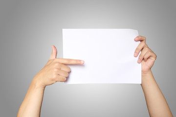 Asian men hands holding the white blank paper isolated on grey white background.