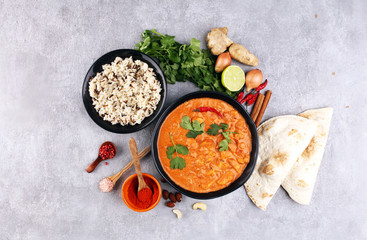 Chicken tikka masala spicy curry meat food in pot with rice and naan bread. indian food