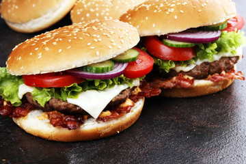 Tasty fresh meat burgers with salad and cheese. Homemade angus burger.