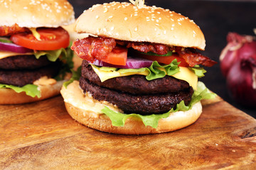 Tasty fresh meat burgers with salad and cheese. Homemade angus burger.