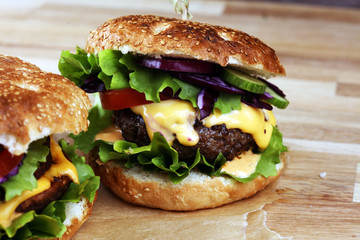 Tasty fresh meat burgers with salad and cheese. Homemade angus burger.