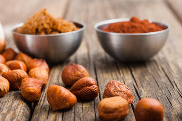 hazelnut cream ingredients on old wooden table