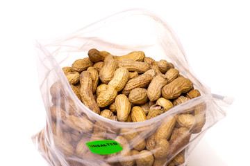 Peanuts in Plastic Bag Isolated on White