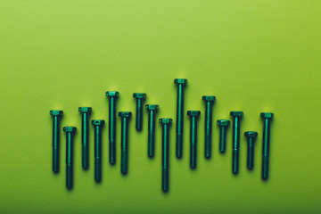 Bolts closeup on green background.
