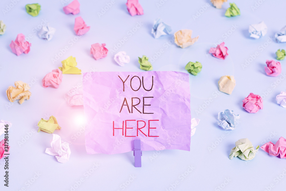 Poster writing note showing you are here. business concept for this is your location reference point global