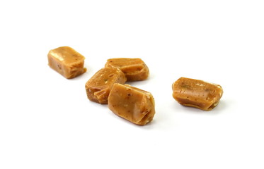 caramel candies isolated on white background