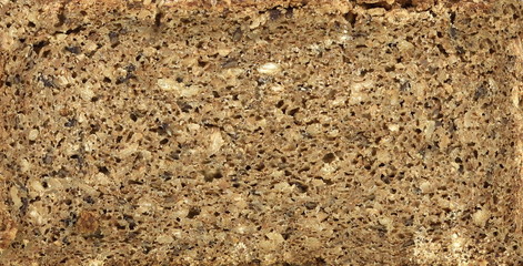 Slices of wholemeal dark bread isolated on a white background in close-up (high details)