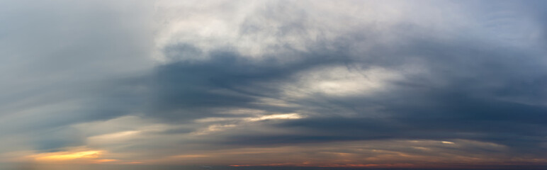 Fantastic dark thunderclouds at sunrise