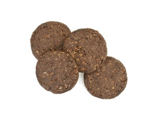 Round chocolate whole wheat biscuit, cookie with raisins isolated on white background. Chocolate Biscuits with whole-wheat (wholemeal) flour isolated on white background 