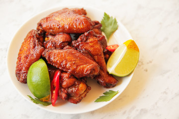 grilled chicken wings with lime and hot pepper.