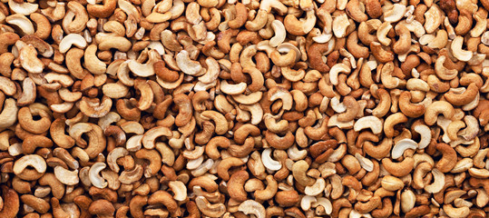 Cashew nuts peeled full background. Panorama. Banner.