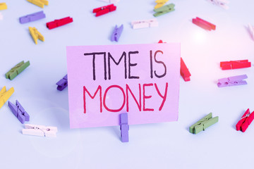 Handwriting text writing Time Is Money. Conceptual photo time is a valuable resource Do things as quickly as possible Colored clothespin papers empty reminder blue floor background office pin