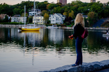 Fototapeta na wymiar Woman walking around Halifax harbor