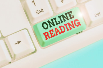 Writing note showing Online Reading. Business concept for process of extracting meaning is in a...
