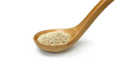 Organic Quinoa (Chenopodium quinoa) seeds in a wooden spoon isolated on white background. Macro close up. Top view. quinoa seeds isolated on white background. 