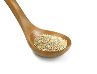 Organic Quinoa (Chenopodium quinoa) seeds in a wooden spoon isolated on white background. Macro close up. Top view. quinoa seeds isolated on white background. 