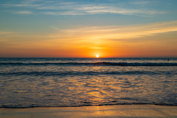 Fototapeta na wymiar Beautiful sunset on the ocean Kuta beach of Bali island, Indonesia
