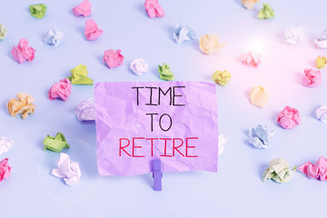 Writing note showing Time To Retire. Business concept for Take the pensioner status stop working in elderly old enough Colored crumpled papers empty reminder blue floor background clothespin