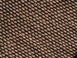 The background is made of knitted fabric brown and black