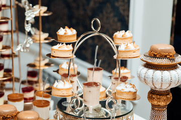 Candy bar with sweets and cakes. Delicious sweet buffet with cupcakes. Sweet holiday buffet with cupcakes. Food and snack Decoration setting for party or celebration event.