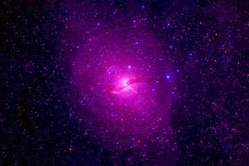 A pink galaxy in deep space. Elements of this image were furnished by NASA.