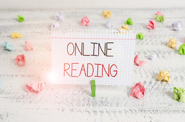 Writing note showing Online Reading. Business concept for process of extracting meaning is in a...