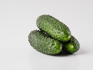 Fresh green cucumber on white background.