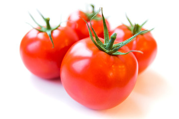 Four delicious ripe red tomatoes on white background. Side view. Healthy and organic food concept. Agriculture and harvesting. Vegetable store in supermarket. Illustration for price tag.