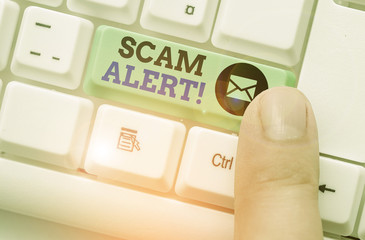 Handwriting text writing Scam Alert. Conceptual photo fraudulently obtain money from victim by...