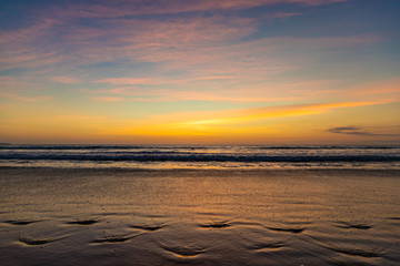 Beautiful sunset on the ocean Kuta beach of Bali island, Indonesia