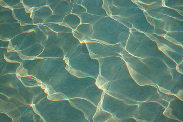 Beautiful water surface reflecting with the sunlight for background or banner