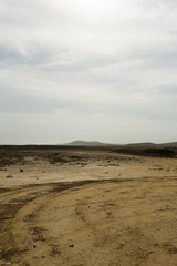Fototapeta na wymiar Dry and arid desert landscape in north-east of Aruba.