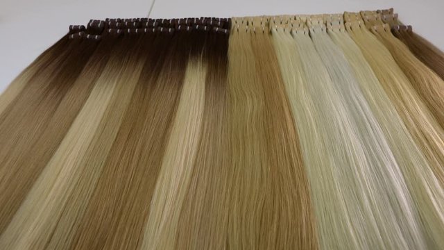 Long beautiful female hair, artificial long female hair in light shades