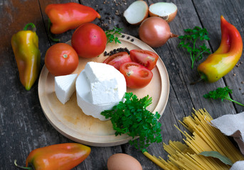 Italian food ingredients on wooden background