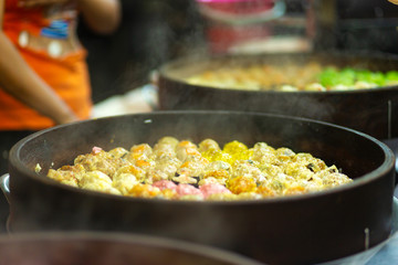 Colorful steamed dim sum, chinese dumpling in a wooden steamer. at Jalan Alor night market, Kuala Lumpur, Malaysia