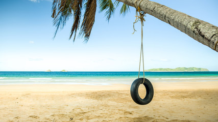 Swing on palm on paradise Nacpan beach, El Nido, Palawan, Philippines