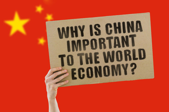 The phrase " Why is China important to the world economy? " on a banner in men's hand with blurred Chinese flag on the background. Finance. Business. Money. Global. Yen. Market. Global trade
