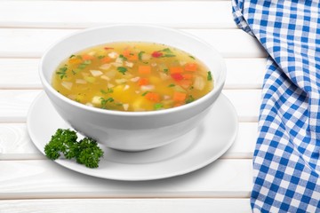 Bowl of delicious vegetables soup on  table