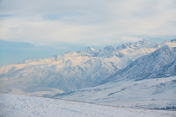 Fototapeta na wymiar Cliffs of Snowy Mountains
