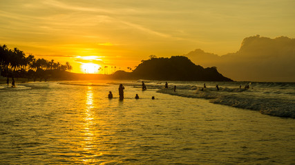 Beautiful fiery sunset on Nacpan beach, Palawan, Philippines