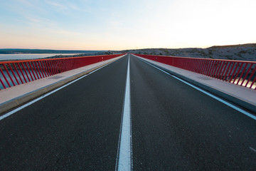 Red Bridge over the canyon in Croatia at sunset.