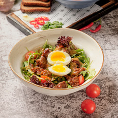 Leaf salad with poached egg and red meat. Dinner Idea. A healthy, delicious brunch.